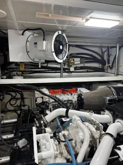 Arlene Yacht Photos Pics Engine room of 2009 Horizon Vision 74 yacht, featuring complex machinery and ventilation system.