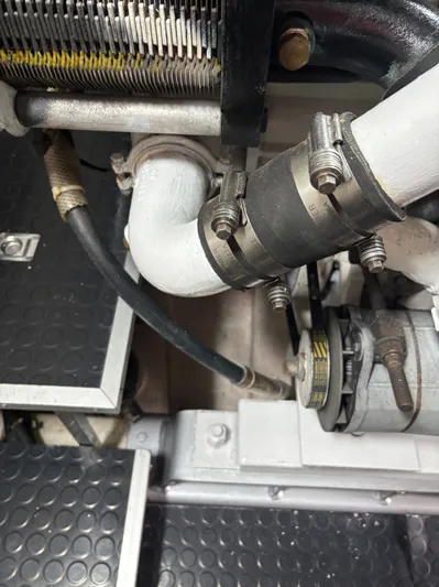 Arlene Yacht Photos Pics Engine components of a 2009 Horizon Vision 74, featuring hoses and clamps.