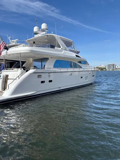 Arlene Yacht Photos Pics Luxurious 2009 Horizon Vision 74 yacht docked on a sunny day.