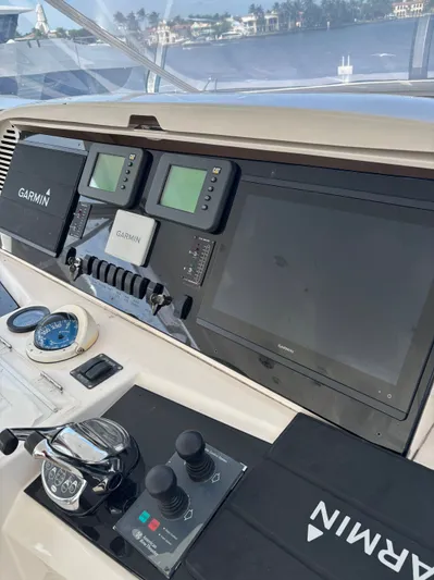 Arlene Yacht Photos Pics Control panel of 2009 Horizon Vision 74 yacht with Garmin navigation systems.