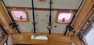  Yacht Photos Pics Interior view of 2010 Mission-Craft Mis 35 boat ceiling with fishing rods and windows.