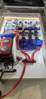  Yacht Photos Pics Electrical system with red cables and blue battery, Mission-Craft Mis 35, 2010 model.