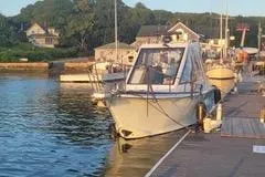  Yacht Photos Pics Boat docked at marina, Mission-Craft Mis 35, 2010 model, in serene waters.
