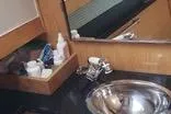  Yacht Photos Pics Compact bathroom in 2010 Mission-Craft Mis 35 boat with sink and toiletries.