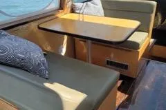  Yacht Photos Pics Interior of 2010 Mission-Craft Mis 35 boat with seating and table.