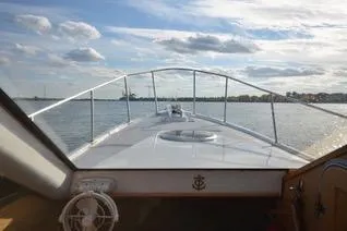  Yacht Photos Pics Front view from Mission-Craft Mis 35 boat, 2010 model, cruising on a calm waterway.