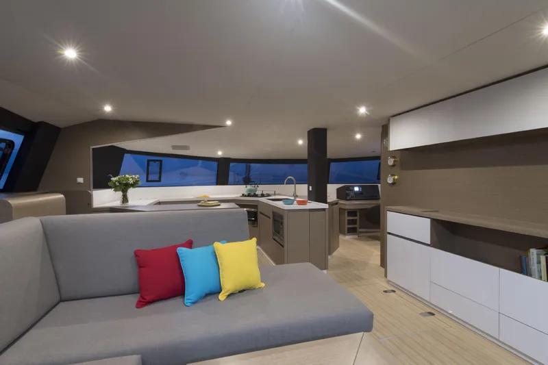 Dauntless Yacht Photos Pics Luxurious NEEL 51 yacht interior with modern kitchen and colorful cushions, 2022 model.