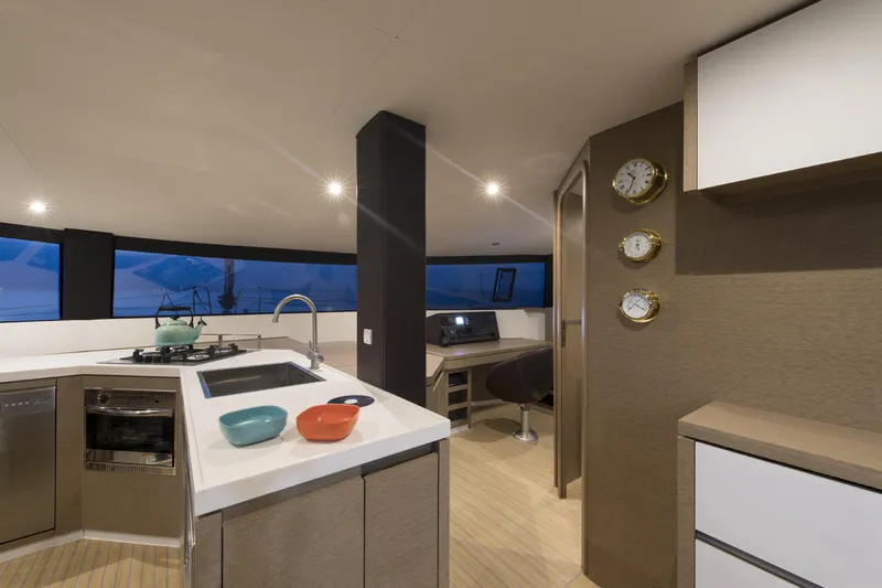 Dauntless Yacht Photos Pics Modern kitchen interior on 2022 NEEL 51 yacht with sleek design and ocean view.
