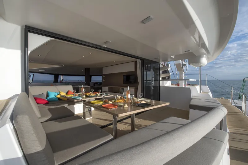 Dauntless Yacht Photos Pics Luxurious NEEL 51 yacht interior with dining area, modern design, and ocean view, 2022 model.