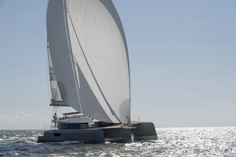 Dauntless Yacht Photos Pics Sailing trimaran NEEL 51, 2022 model, gliding on open sea with full sails.