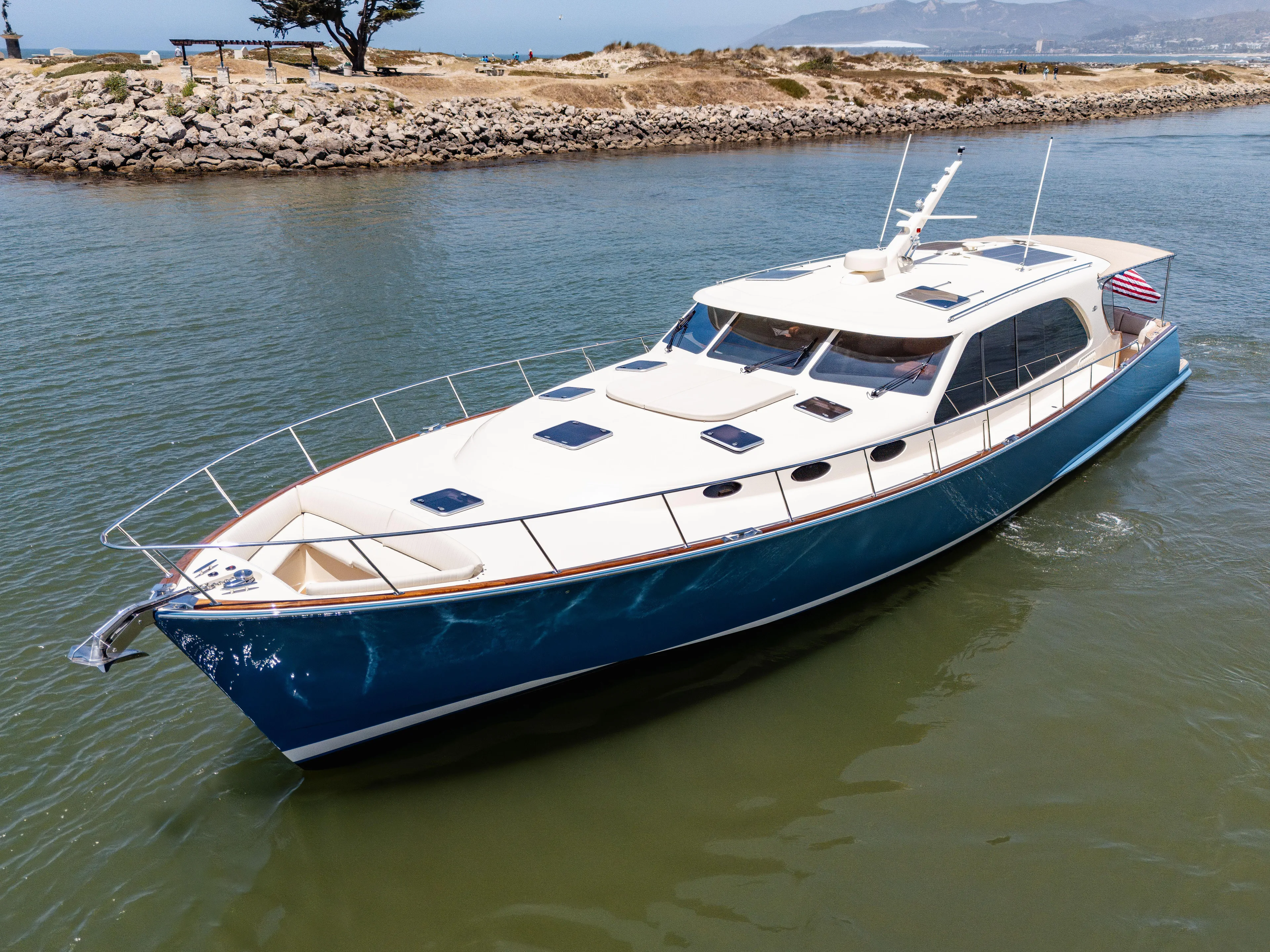 Margin Yacht Photos Pics 2025 Palm Beach Motor Yachts PB70 cruising in a scenic coastal waterway.