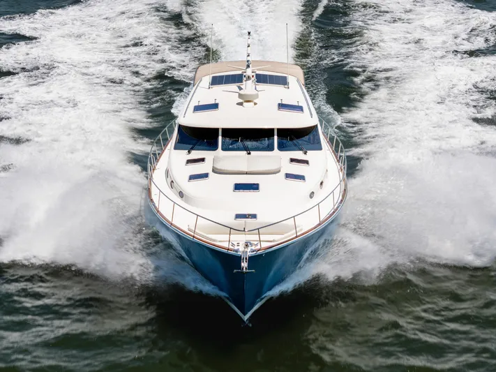 Margin Yacht Photos Pics 2025 Palm Beach Motor Yachts PB70 cruising on open water, front view.