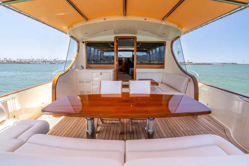 Margin Yacht Photos Pics Luxurious 2025 Palm Beach Motor Yachts PB70 with elegant teak deck and spacious seating area.