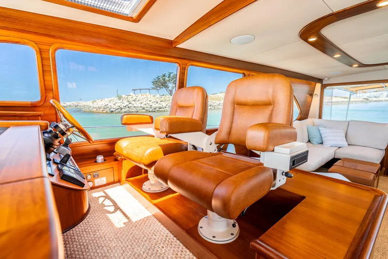 Margin Yacht Photos Pics Luxurious 2025 Palm Beach Motor Yachts PB70 interior with leather seating and ocean view.