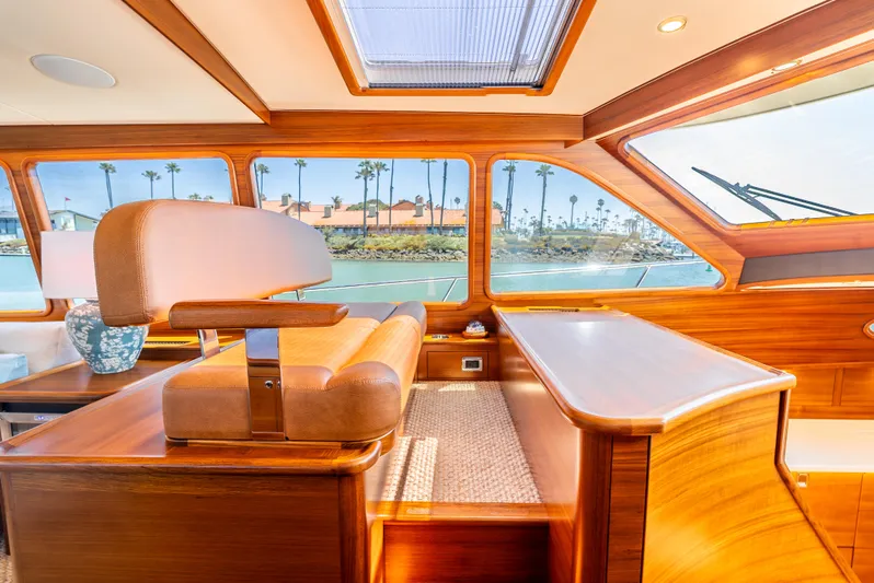 Margin Yacht Photos Pics Luxurious interior of 2025 Palm Beach Motor Yachts PB70, featuring elegant wood finishes and scenic views.