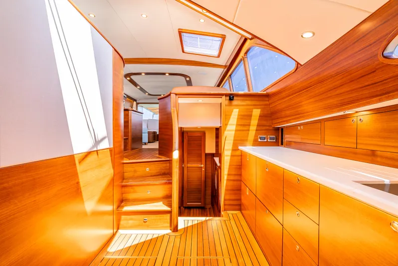 Margin Yacht Photos Pics Luxurious interior of 2025 Palm Beach Motor Yachts PB70 with elegant wood finishes and modern design.
