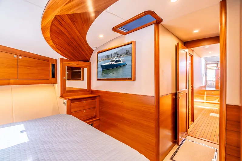 Margin Yacht Photos Pics Luxurious interior of 2025 Palm Beach Motor Yachts PB70, featuring elegant wood finishes.