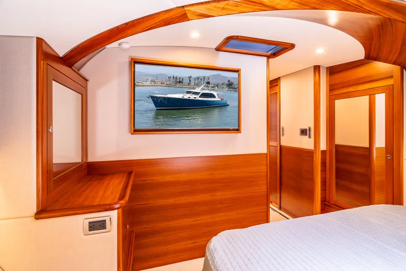 Margin Yacht Photos Pics Luxurious interior of 2025 Palm Beach Motor Yachts PB70 with elegant wood finishes.
