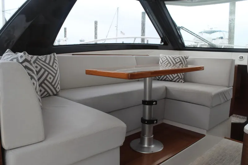 Dream Weaver Yacht Photos Pics Luxurious seating area on 2021 Ocean Alexander 45 Divergence Coupe yacht with modern cushions.