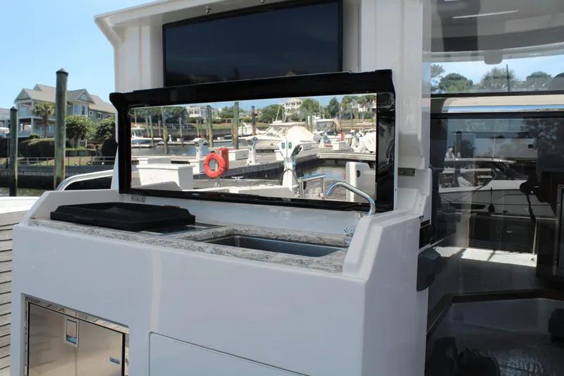 Dream Weaver Yacht Photos Pics 2021 Ocean Alexander 45 Divergence Coupe yacht with outdoor sink and marina view.