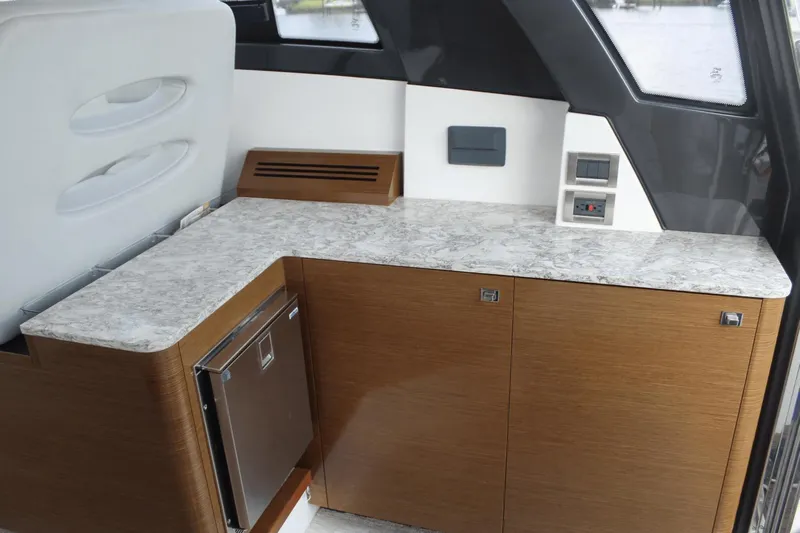 Dream Weaver Yacht Photos Pics Interior of 2021 Ocean Alexander 45 Divergence Coupe with sleek cabinetry and marble countertop.