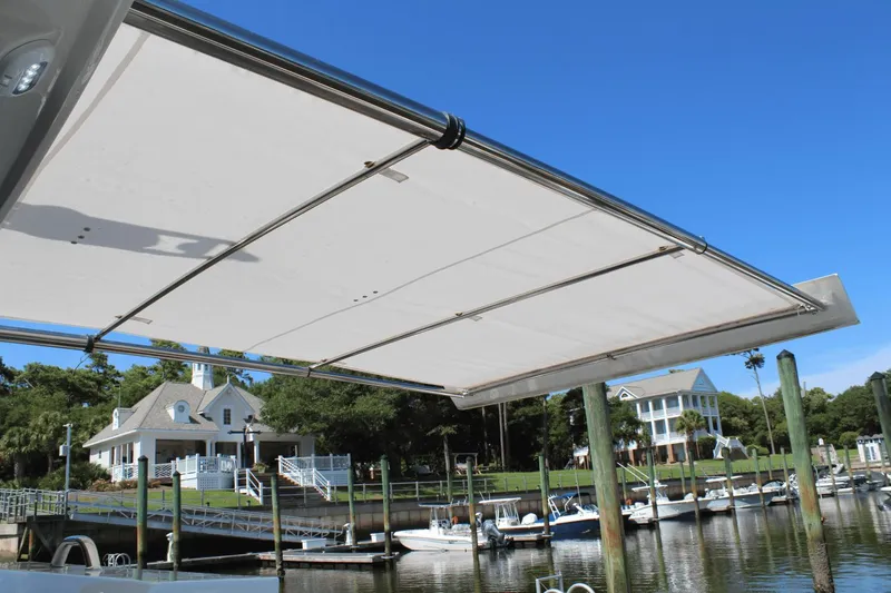 Dream Weaver Yacht Photos Pics 2021 Ocean Alexander 45 Divergence Coupe with extended sunshade at marina.