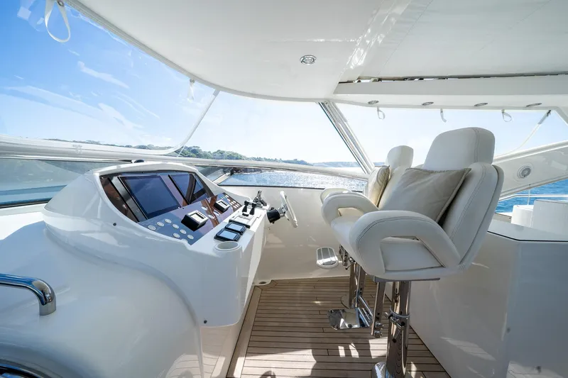 2010 Sunseeker Mega Yacht Yacht Photos Pics Luxurious Sunseeker 30M yacht helm with plush seating and modern controls, 2010 model.