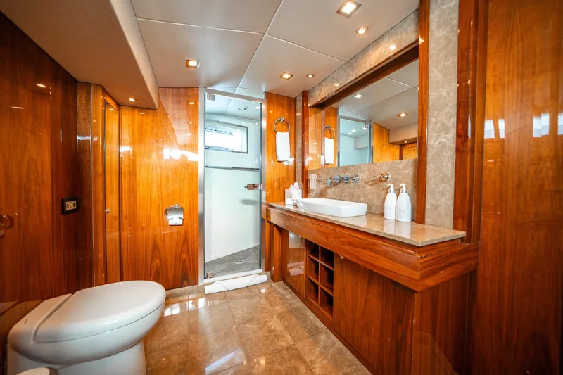 2010 Sunseeker Mega Yacht Yacht Photos Pics Luxurious bathroom interior of 2010 Sunseeker 30M yacht with wooden finishes and modern fixtures.