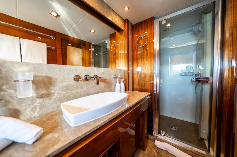 2010 Sunseeker Mega Yacht Yacht Photos Pics Luxurious bathroom on a 2010 Sunseeker 30M yacht with elegant wood and marble finishes.