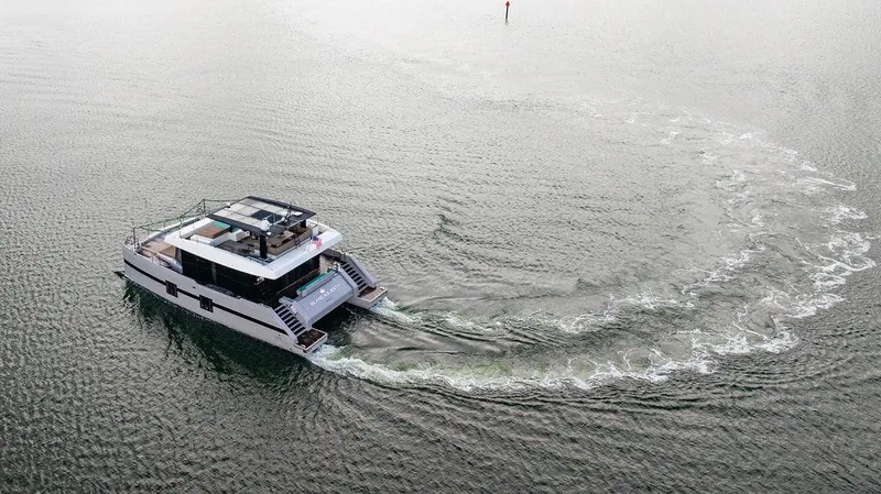 Island Majesty Yacht Photos Pics Aerial view of 2018 Sunreef 70 yacht cruising in open water.