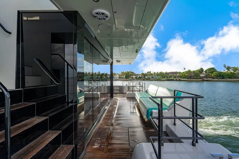 Island Majesty Yacht Photos Pics Luxurious Sunreef 70 yacht deck with seating, overlooking serene waters, 2018 model.