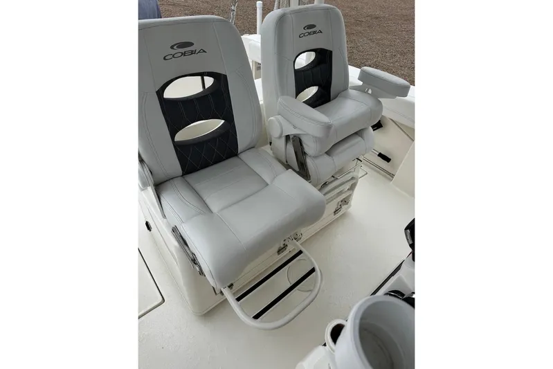  Yacht Photos Pics 2023 Cobia 301 Center Console boat seats with armrests and footrests.