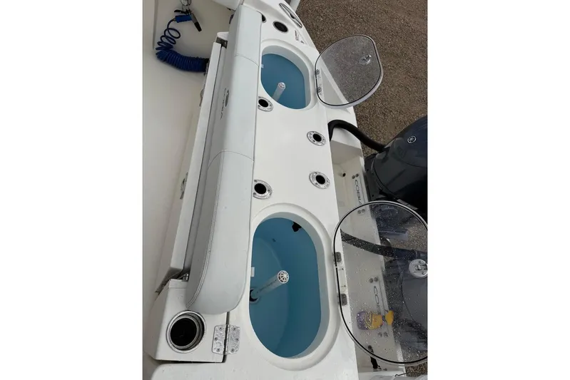  Yacht Photos Pics 2023 Cobia 301 Center Console boat with livewell and rod holders.