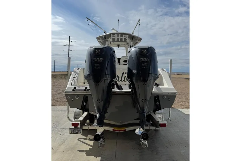  Yacht Photos Pics 2023 Cobia 301 Center Console boat with dual 300 HP outboard engines, rear view.