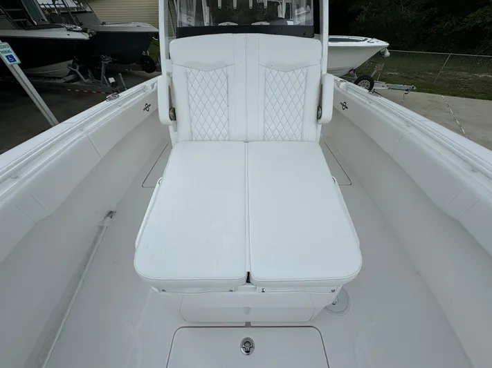  Yacht Photos Pics 2025 Fountain 34TE boat interior with white cushioned seating.