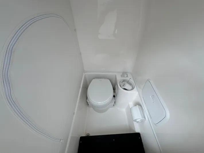  Yacht Photos Pics 2025 Fountain 34TE boat bathroom interior with toilet and sink.