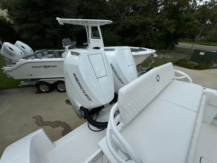 Yacht Photos Pics 2025 Fountain 34TE boat with Mercury engines, parked on a trailer.