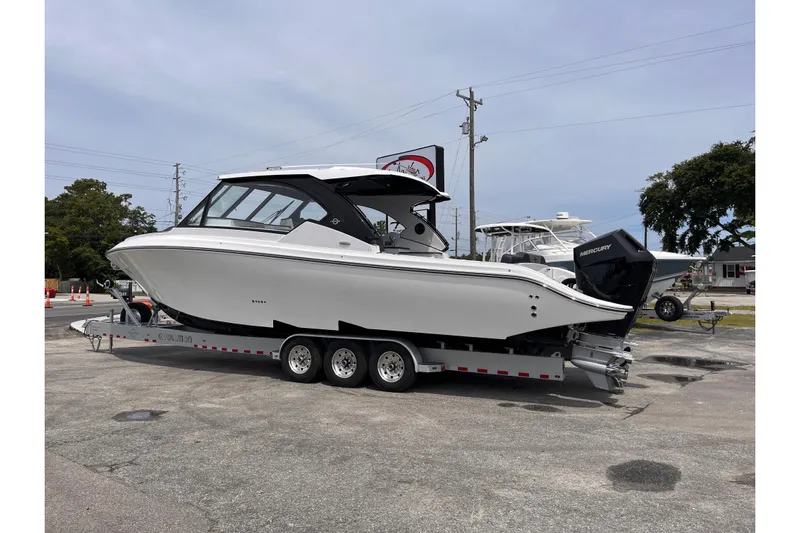  Yacht Photos Pics 2025 Fountain 39 DX boat on trailer, parked outdoors, side view.