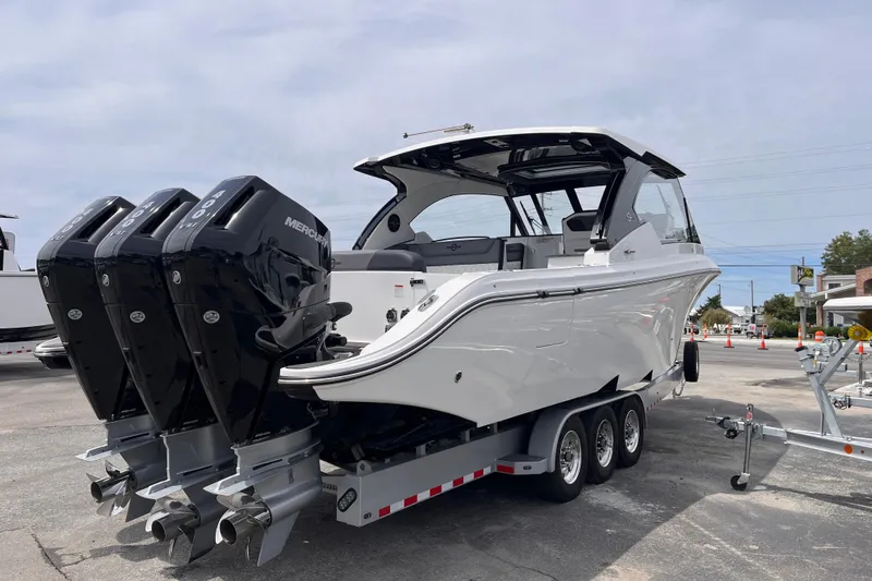  Yacht Photos Pics 2025 Fountain 39 DX boat with triple Mercury engines on a trailer.