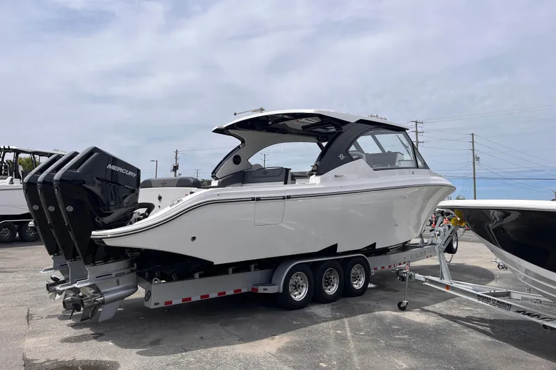  Yacht Photos Pics 2025 Fountain 39 DX boat on trailer with triple Mercury outboard engines.
