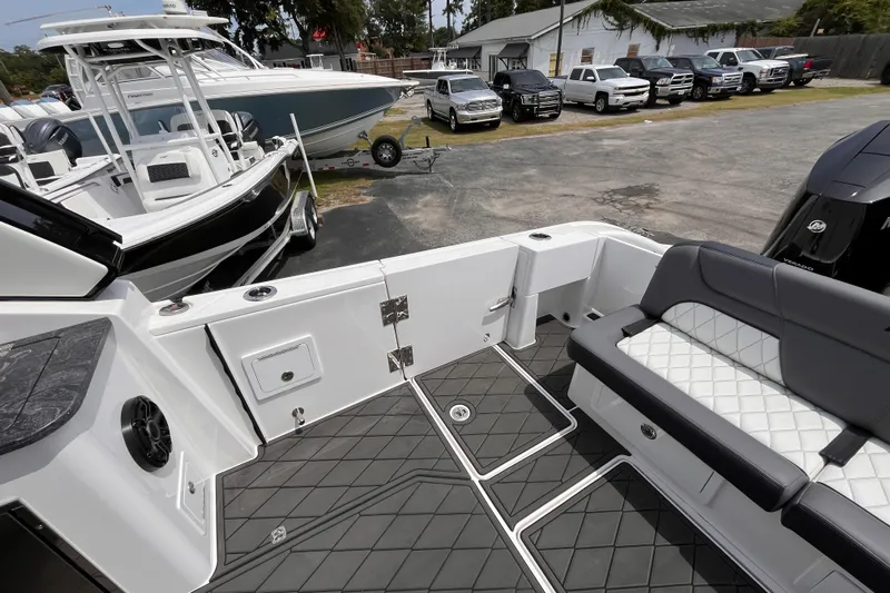  Yacht Photos Pics 2025 Fountain 39 DX boat interior with sleek seating and modern design at a dealership.