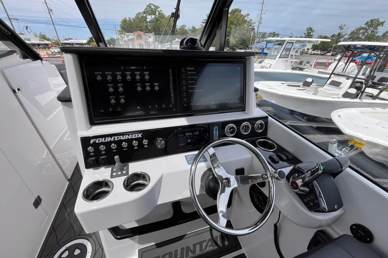  Yacht Photos Pics 2025 Fountain 39 DX boat cockpit with advanced controls and navigation screens.