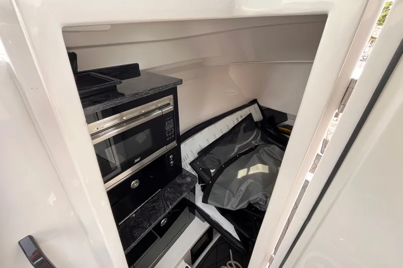  Yacht Photos Pics Interior of 2025 Fountain 39 DX boat with microwave and storage area.