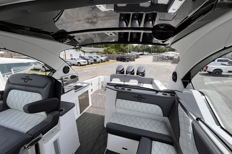  Yacht Photos Pics Luxurious 2025 Fountain 39 DX boat interior with plush seating and modern amenities.
