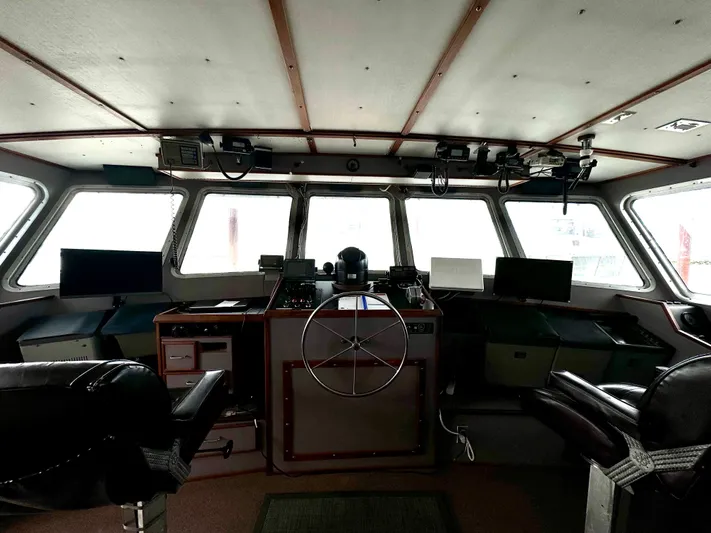 Western Shore Yacht Photos Pics 1989 Custom Expedition Yacht bridge with steering wheel and navigation equipment.