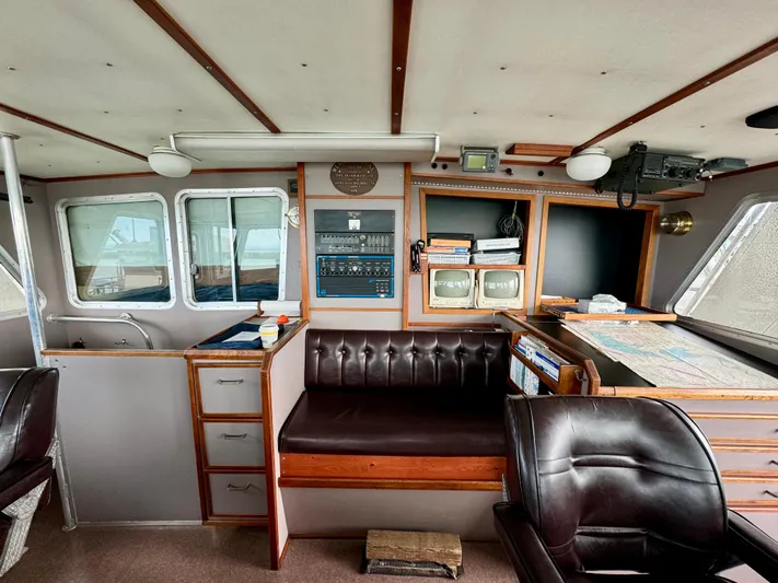 Western Shore Yacht Photos Pics Interior of a 1989 custom expedition yacht with navigation equipment and leather seating.