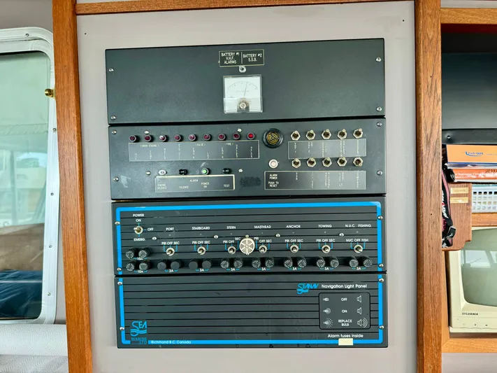 Western Shore Yacht Photos Pics Control panel of a 1989 Custom Expedition Yacht with various switches and dials.