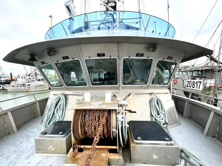 Western Shore Yacht Photos Pics Custom 1989 expedition yacht with anchor chain and ropes on deck, docked in marina.