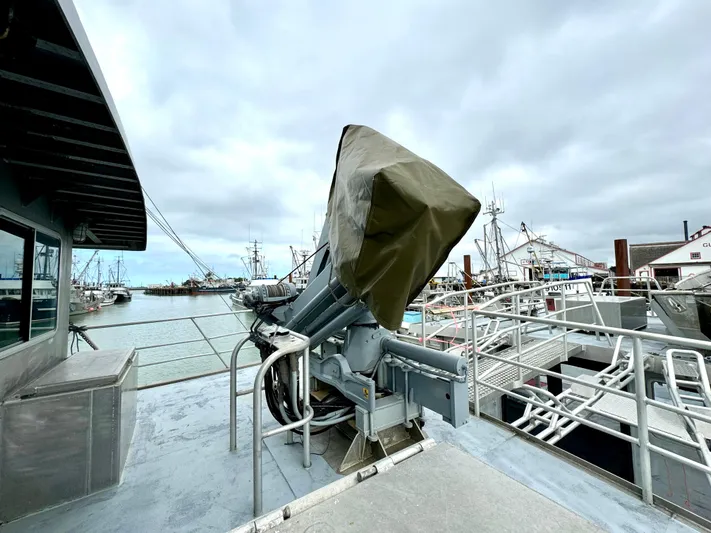 Western Shore Yacht Photos Pics Custom 1989 Expedition Yacht docked, featuring covered equipment and overcast sky.