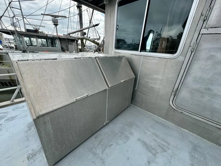 Western Shore Yacht Photos Pics 1989 Custom Expedition Yacht deck with storage compartments and window.